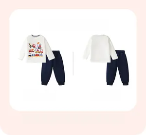 Detail view of boys long-sleeve cotton pajamas with colorful construction vehicle prints