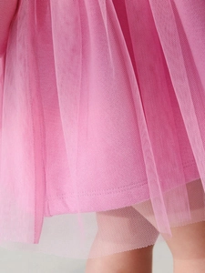 Pink tulle dress for girls featuring a layered mesh skirt and soft cotton lining