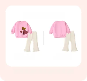 Pink girl's sweatshirt with sequined hearts and cream flared pants, front and back view