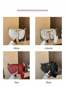 Detail view of tweed saddle bags in white, black, red, and multicolor with gold chains