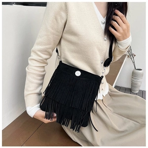 Fashionable black tassel bucket bag with silver metal buckle for women's daily commute