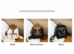 Detailed view of quilted leather backpacks in white, brown, and black with smiley charms