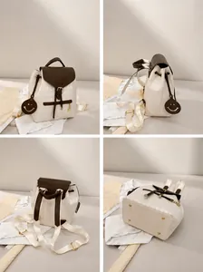 Quilted backpack shown in multi-angle views with drawstring closure and charms