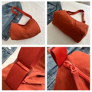 Detailed four-way view of orange nylon crossbody bag with zipper and adjustable strap