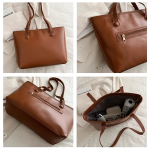 Dettaglio borsa tote in pelle marrone con tasca esterna a zip e ampio spazio interno