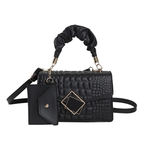 Elegant black embossed crossbody bag with ruched top handle and mini matching pouch