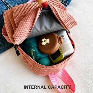 Internal storage capacity of the pink corduroy mini backpack for daily essentials