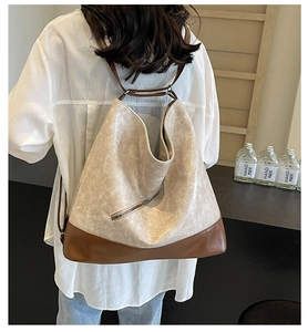 Model view showing the large capacity two-tone crossbody hobo bag with vintage texture