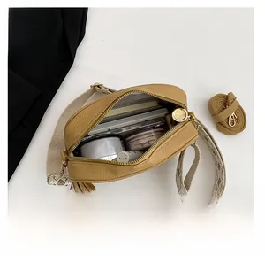 Flat lay of yellow crossbody bag interior showing large capacity for daily essentials