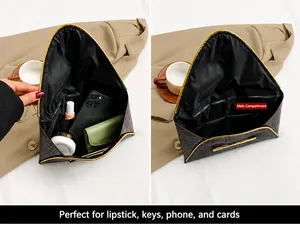 Internal view of brown envelope clutch showing capacity for phone and cosmetics