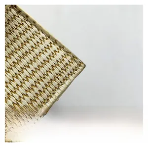 Close-up of dual-tone woven straw texture showing high-quality handcrafted geometric patterns