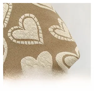 Detail of high quality jacquard canvas fabric with woven heart patterns on the travel bag