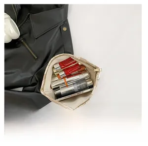 Top view of high-capacity makeup bag showing internal storage for cosmetics and phone