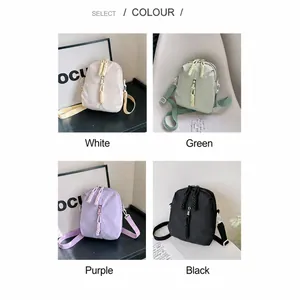 Collage de mini bolsos bandolera de nailon en blanco, verde, violeta y negro con cremalleras