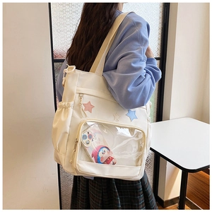 Detail der Canvas-Einkaufstasche mit transparenter PVC-Tasche und Stern-Applikationen