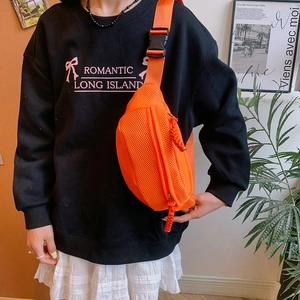 Detail of bright orange mesh waist bag featuring nylon strap and plastic buckle