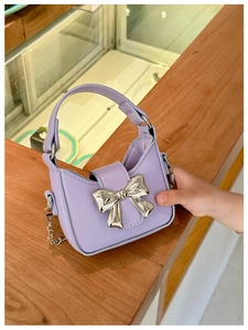 Lavender purple mini handbag for girls featuring silver metal bow and chain strap