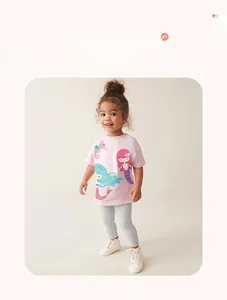 Detail of pink cotton T-shirt featuring mermaid print with grey leggings for girls