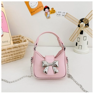 Close-up of pink girls handbag with silver bow detail and metallic chain strap