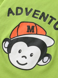 T-shirt vert en coton pour enfants avec singe de dessin animé et bonnet orange