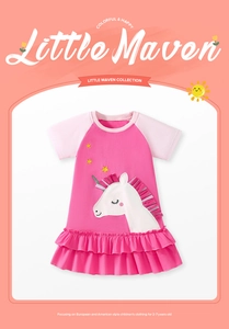 Detail of pink cotton girl dress with unicorn applique and layered ruffled hem