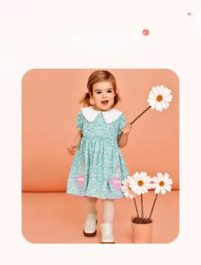Detail of floral girl's dress featuring a lace collar and cute rabbit embroidery pockets