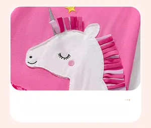 Detail of cute unicorn applique with 3D colorful mane on pink cotton toddler dress