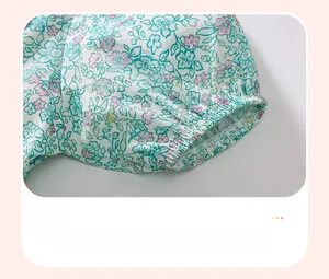 Close-up of elastic floral cuffs on a cotton summer dress with small pink flower prints