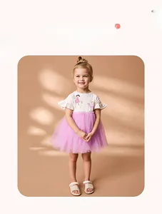 Close-up of girls cotton dress with fairy print, ruffle sleeves and purple mesh skirt