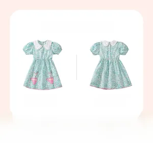 Front and back view of girls floral summer dress with lace collar and bunny patterns