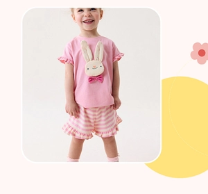 Detail of pink cotton girl's summer set with rabbit applique and ruffle sleeves