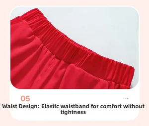 Dettaglio dell'elastico in vita rosso su pantaloncini in cotone e cuciture
