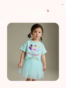 Detail of girls mint green summer set featuring ballet dancers and a mesh tutu skirt