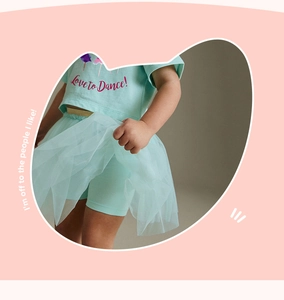 Detail of girls' mint green dance set with Love to Dance print and layered tutu skirt