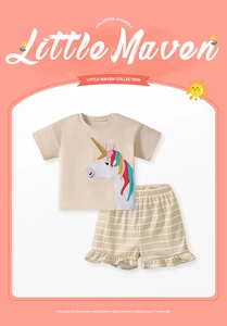 Detail of girls cotton unicorn patch T-shirt and striped shorts with ruffle hem
