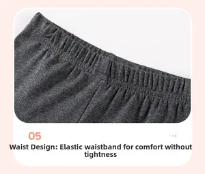 Detail of girls' dark grey knit trousers showing elastic waistband for flexible fit