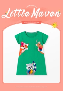 Detail of green cotton dress with fox and raccoon applique embroidery and handmade flowers