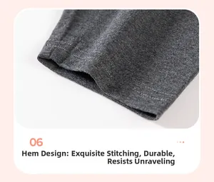 Detail of dark grey girls' cotton pants showing durable double-stitched hem and seams
