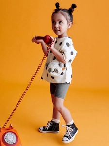 Girls summer set with panda applique polka dot T-shirt and grey shorts on orange background