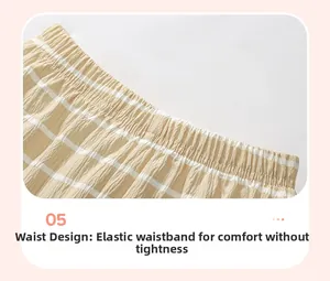Elastic waistband detail on yellow striped seersucker shorts for a comfortable kids fit