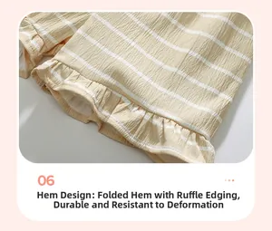 Detail view of yellow and white striped shorts with ruffles at the hem for little girls