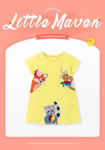 Detail of cartoon animal embroidery with 3D fabric flowers on a yellow cotton dress