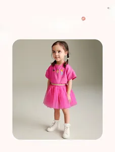 Detail of pink summer girls set featuring ballet dancer print and elastic gold waist tutu