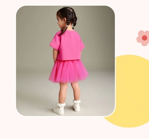 Detail view of pink girls' summer tutu set with layered mesh skirt and short sleeve top