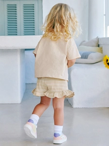 Kids summer cotton set with beige short sleeve tee and striped ruffle shorts in rustic style