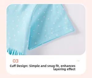 Detail of light blue cotton short sleeve with white star prints and ruffled cuff design