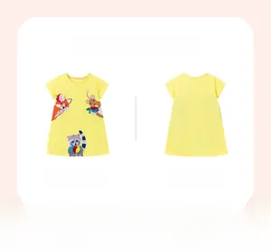 Detail of yellow cotton girl's dress with fox and raccoon cartoon embroidery appliques