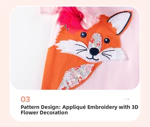 Detail of pink toddler dress with fox patch embroidery and a 3D floral accent