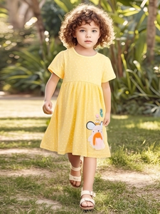 Girl's summer cotton dress in yellow polka dots with cute cartoon animal applique