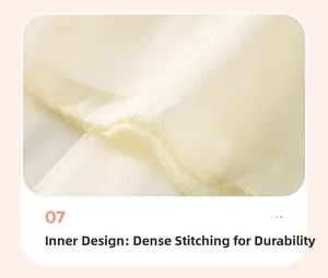 Détail des coutures renforcées de la doublure intérieure d'une robe en tulle